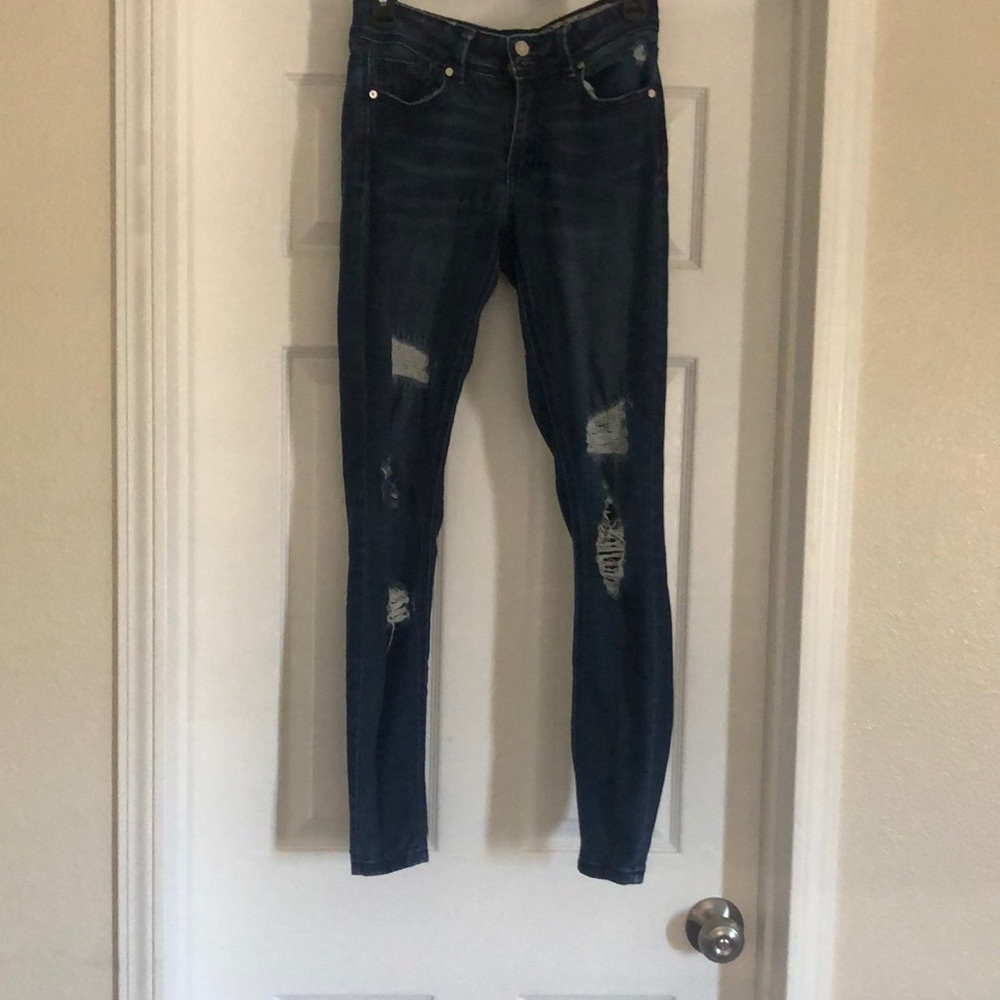 Dark blue ripped jeans